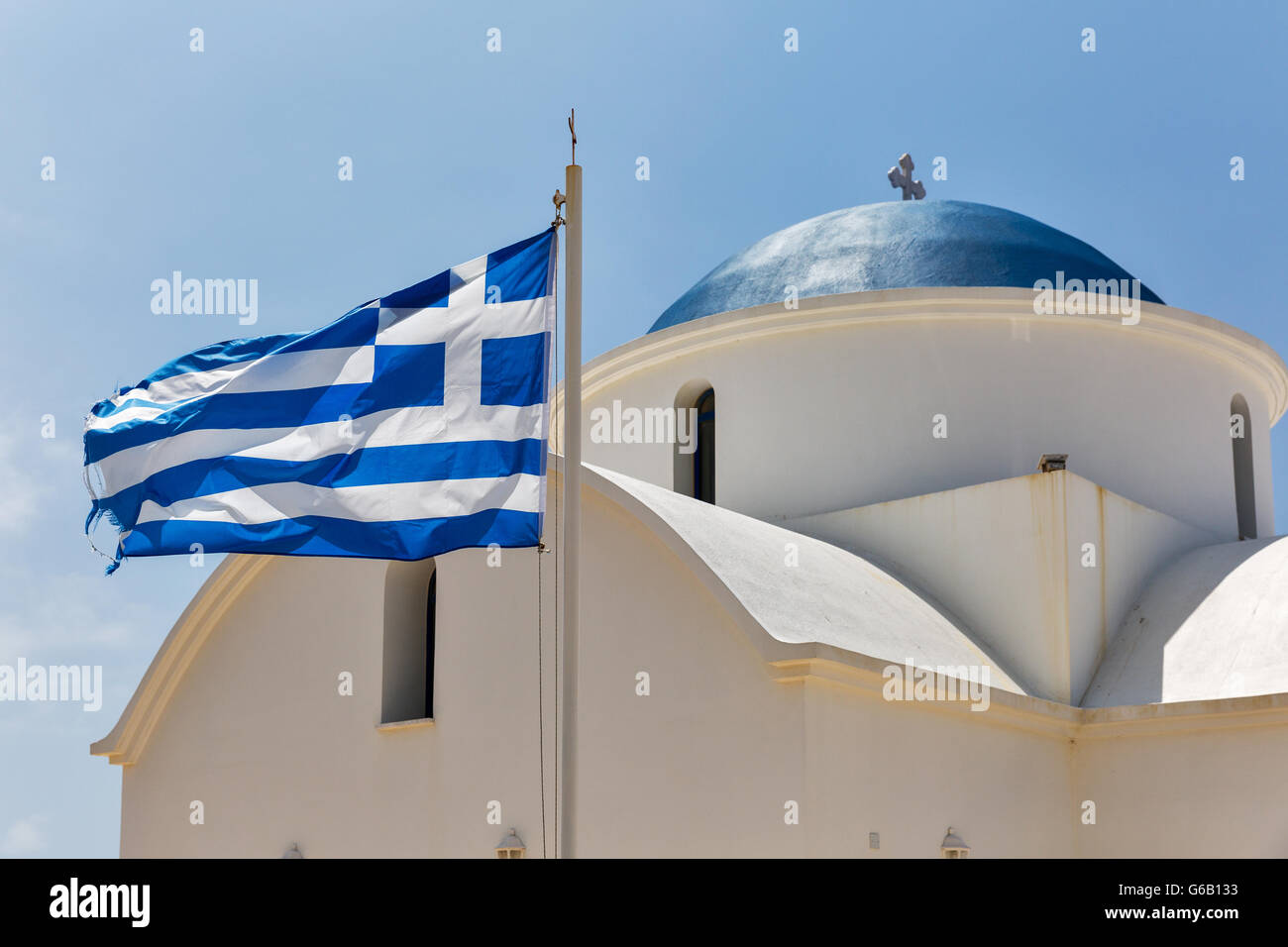 Greek orthodox church with national flag closeup in Paphos, Cyprus. Stock Photo