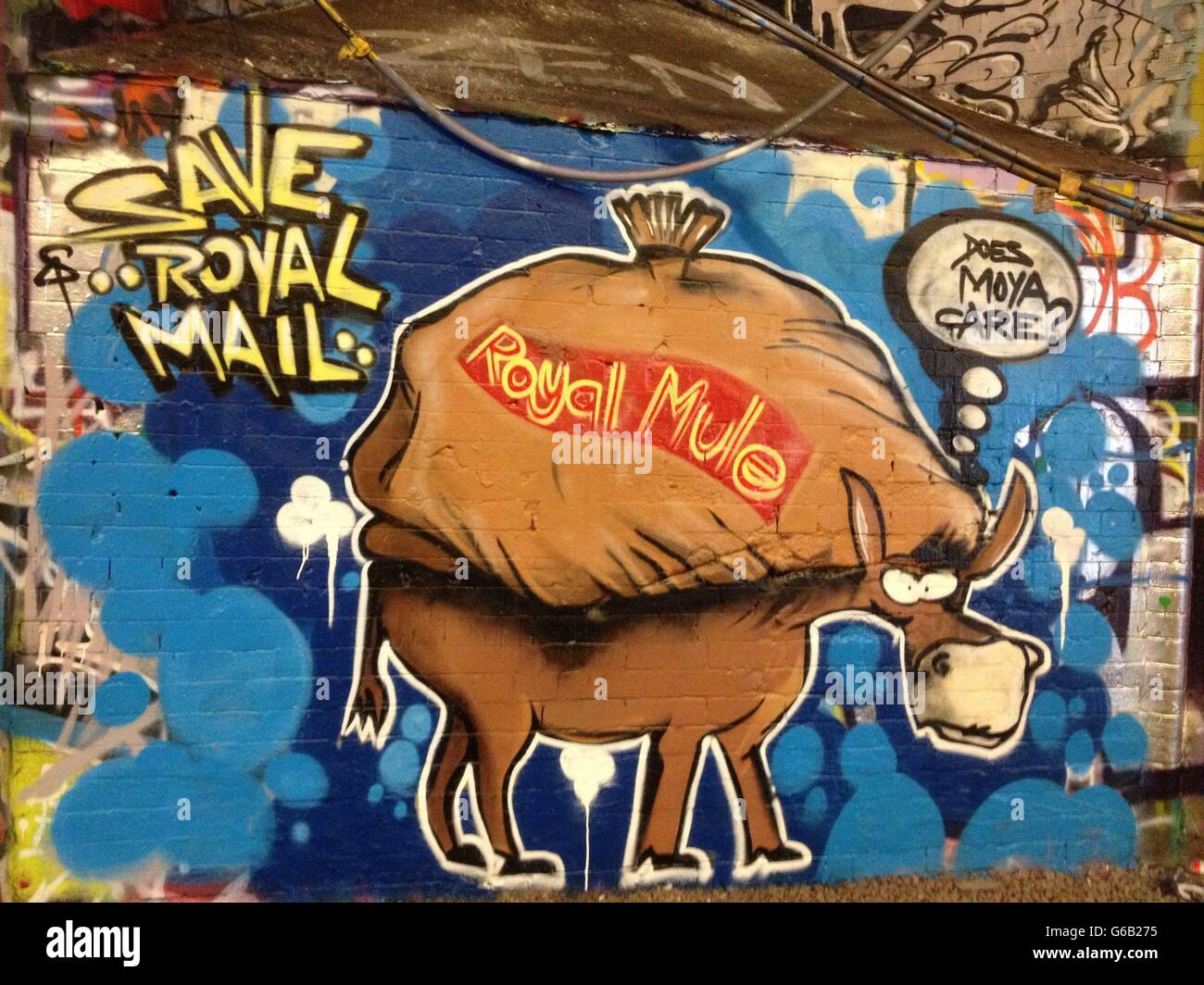 A grafitti artwork that has appeared in Leake Street, also known as Banksy Tunnel, near Waterloo Station in south London against the proposed privatisation of Royal Mail. Stock Photo