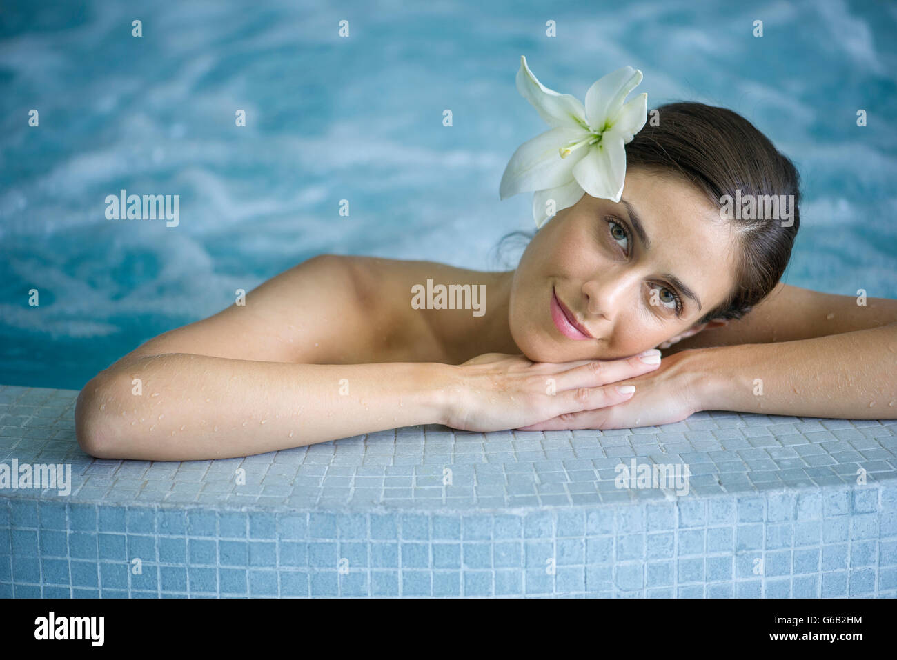 Woman relaxing in jacuzzi Stock Photo