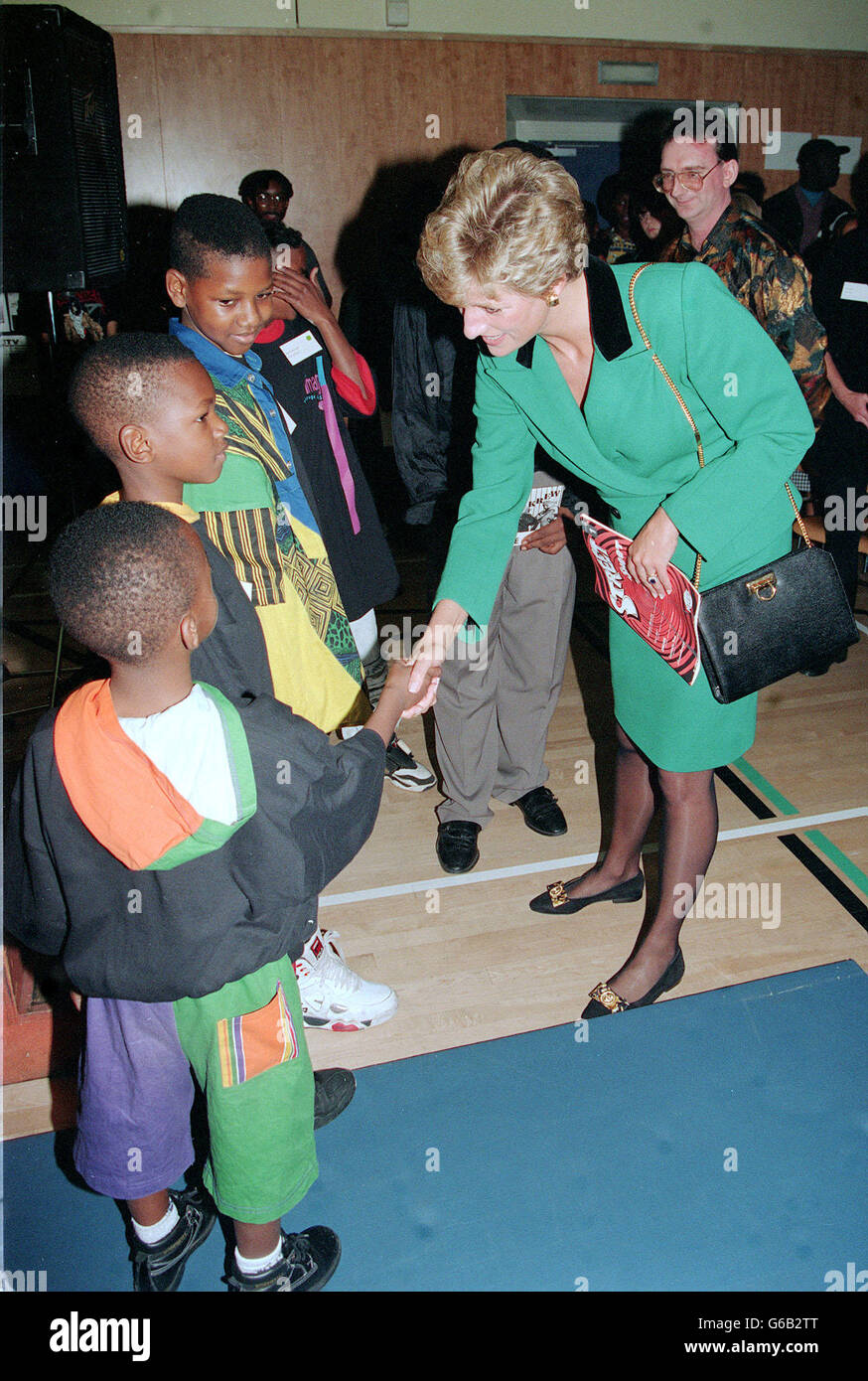 Princess of Wales shakes hands with Stefan Sinclair who with his ...