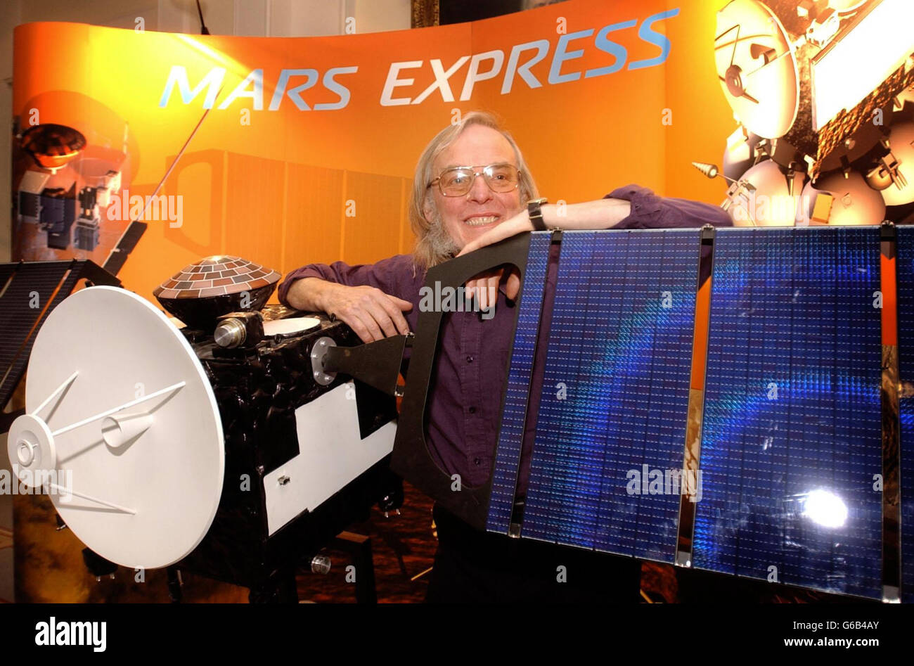 Professor Colin Pillinger with a model of the orbiter Mars Express, at the Royal Society, London. * The orbiter, which is scheduled to blast off from a launch pad in Kazakhstan on June 2 2003, will carry his lander 'Beagle 2' that will reach Mars by christmas in the hope of finally discovering whether life has ever existed on the Red Planet. Stock Photo