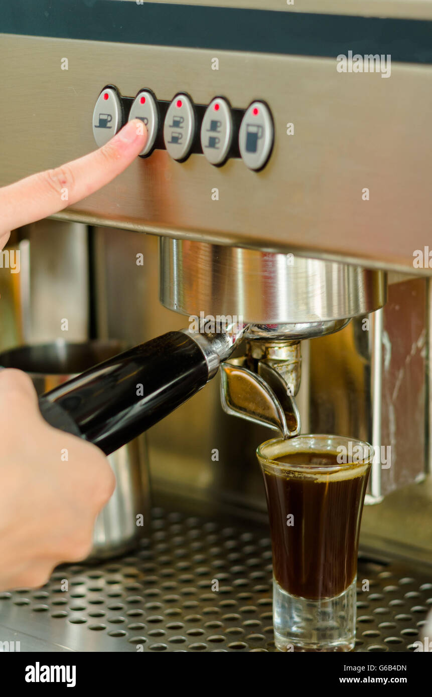 https://c8.alamy.com/comp/G6B4DN/female-hands-working-operating-industrial-coffee-maker-pouring-espresso-G6B4DN.jpg