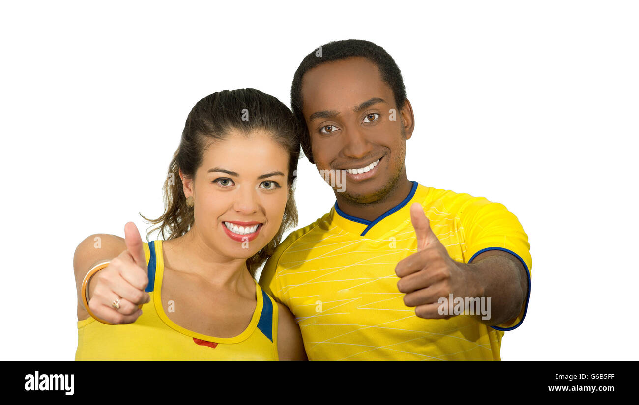 Charming Interracial Couple Wearing Yellow Football Shirts Giving Thumbs Up To Camera White