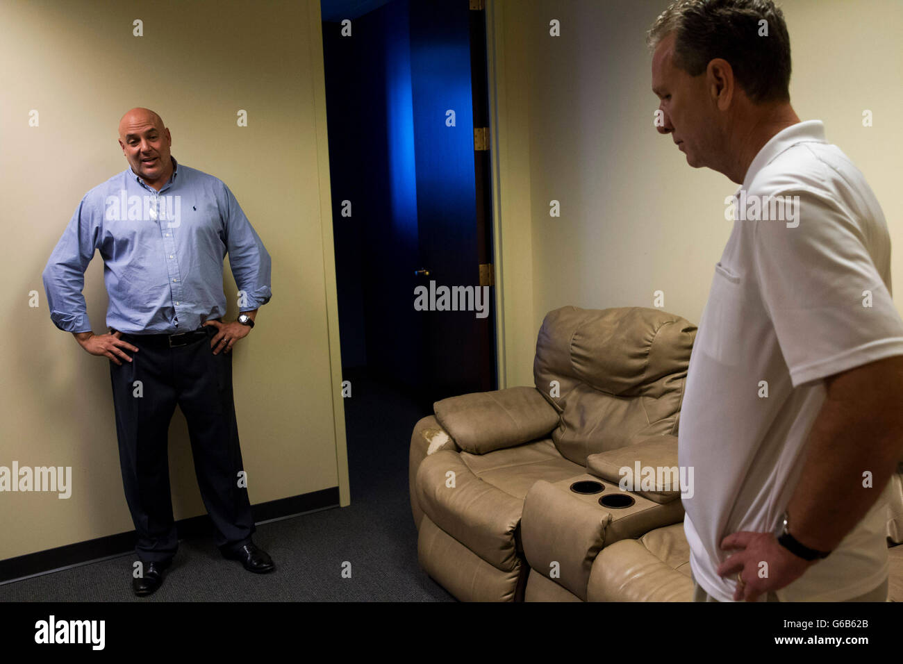 Tampa, Florida, USA. 23rd June, 2016. WILL VRAGOVIC | Times.Attorney Stephen Cohen, left, and Cliff Brown talk with reporters on Thursday, June 23, 2016, in Cohen's offices at Bajo Cuva Cohen & Turkel, P.A. where Brown's couch he purchased at Kane's Furniture is being held as evidence in downtown Tampa. Brown and his law firm have filed a lawsuit seeking class action status against Kane's Furniture. The suit alleges Kane's sold what it billed as leather furniture that was actually ''bonded leather, '' or about 17% leather, that would crack, peel, flake and deteriorate. The suit says the co Stock Photo