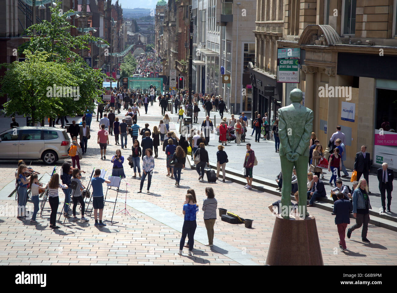 Glasgow, Scotland, UK. 23rd June, 2016. On the day of the Brexit vote The Glasgow Gaelic School ironically perform to finance their class European trip in the shadow of Donald Dewar, the father of the Scottish devolution. Credit:  Gerard Ferry/Alamy Live News Stock Photo