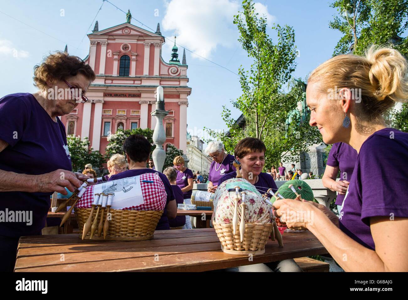Ljubljana, Slovenia. 23rd June, 2016. Women make lace during a lacemaking event marking the beginning of the 17th OIDFA (international lace organization) World Lace Congress and General Assembly in Ljubljana, Slovenia, June 23, 2016. Nearly a thousand lace makers from all over the world attended the event on Friday. © Luka Dakskobler/Xinhua/Alamy Live News Stock Photo