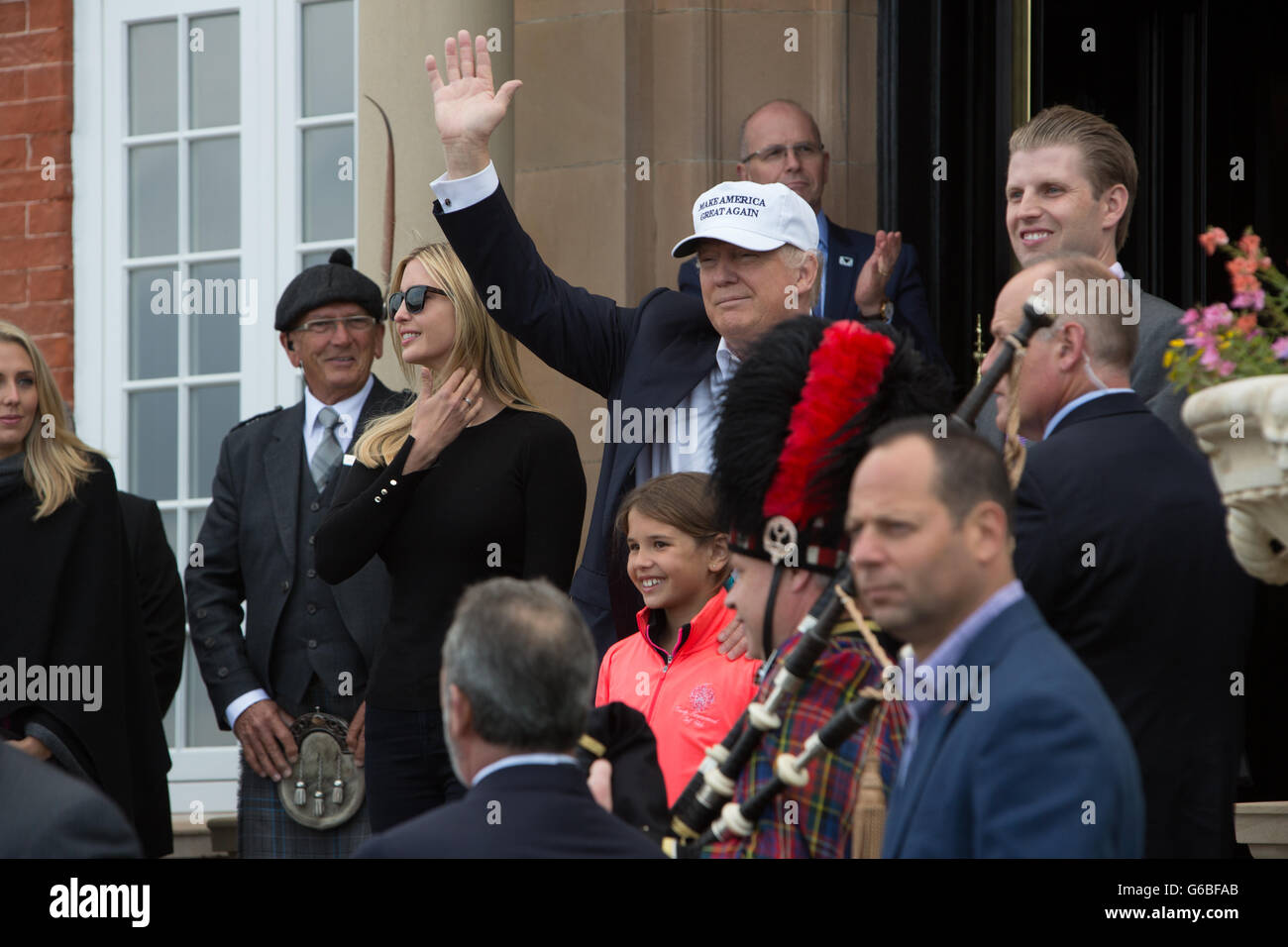 Donald Trump (centre),with Ivanka Trump, daughter, and son Eric,  ....Republic presidential nominee Donald Trump arrives by helicopter, with his family members, at his Turnberry Golf Course, in Turnberry, Scotland, on 24 June 2016. Stock Photo