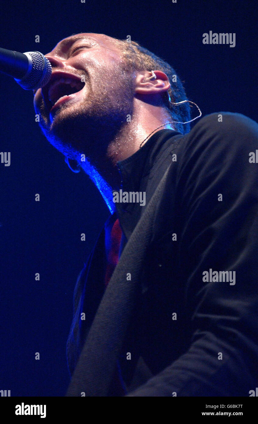 Chris Martin, lead singer of rock band Coldplay performing live at Earls Court. Stock Photo