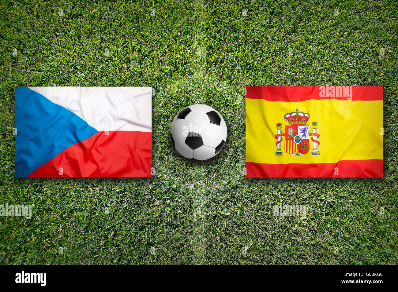 Czech Republic vs. Spain flags on green soccer field Stock Photo