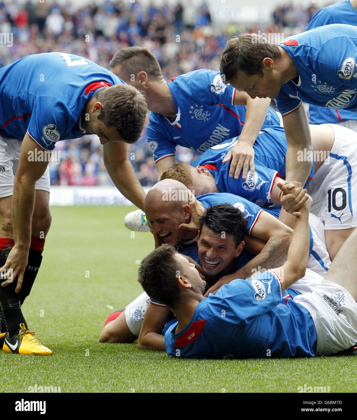 Rangers' Chris Hegarty celebrates his goal with teammates during the Scottish League Two match at Ibrox, Glasgow. Stock Photo