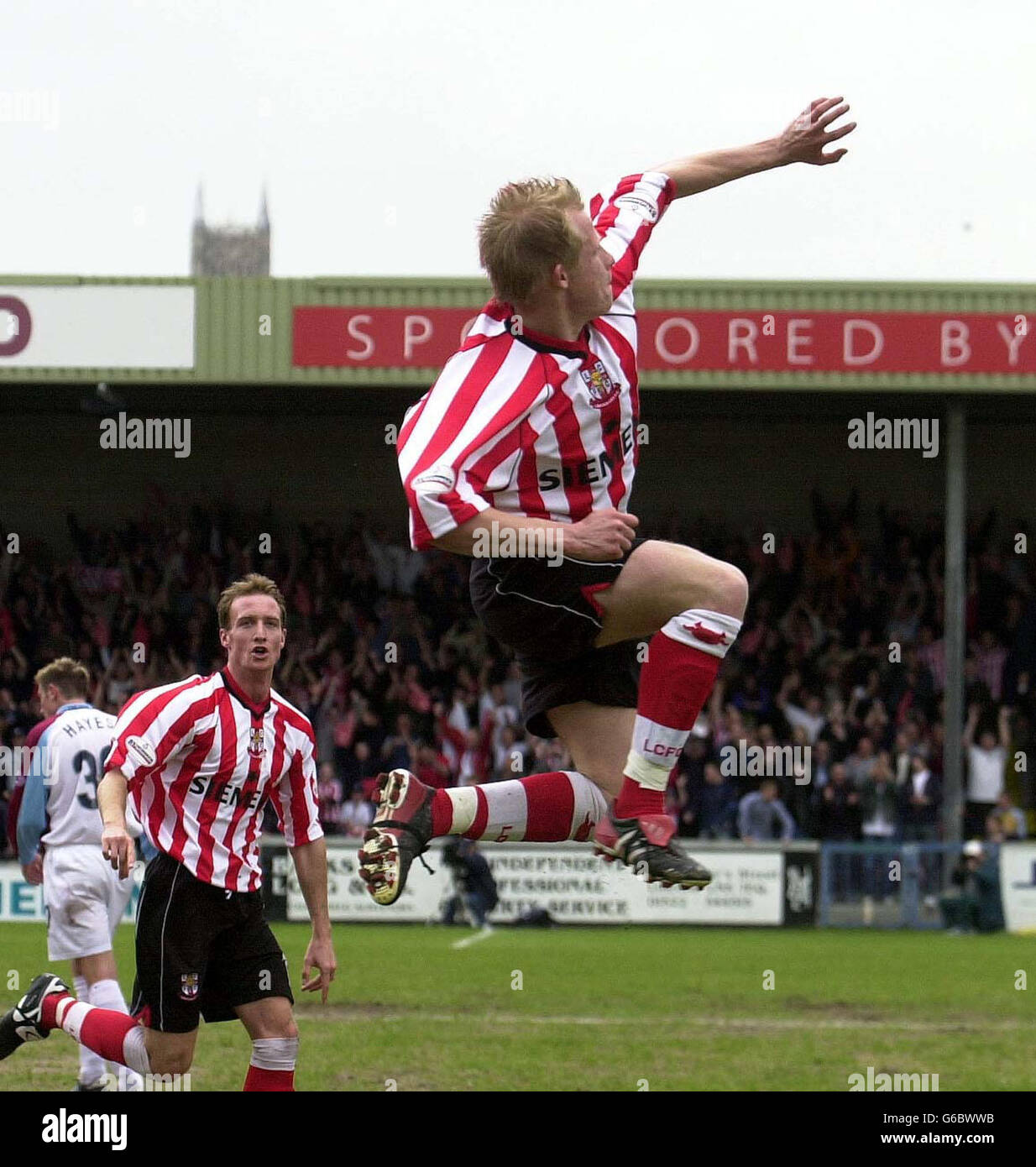 Lincoln's Paul Mayo leaps in delight after putting his team 2-0 up against Scunthorpe, during their Nationwide Division Three semi-final 1st leg match at Sincil Bank, Lincoln NO UNOFFICIAL CLUB WEBSITE USE. Stock Photo