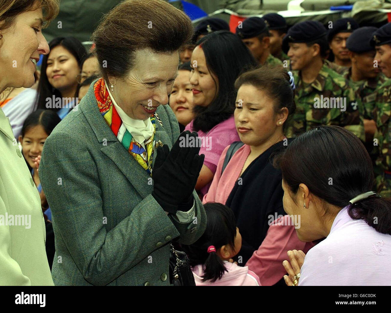 The Princess Royal uses the traditional Gurkha namaste greeting as she meets relatives and soldiers from the 2 Signal Regiment, at Imphal Barracks, York, after their return from the war in Iraq. * The Princess spent around an hour chatting to the families and was presented with a garland from Uchan Thapa, five, whose father Un Thapa is a Gurkha in the regiment. Millie Oulton whose father Phil also serves in the Regiment presented the Princess with a posy. Stock Photo