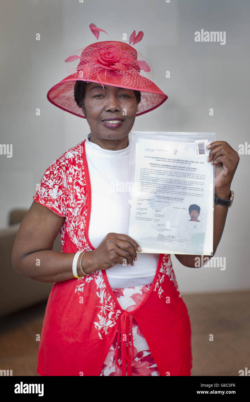 RETRANSMITTED WITH ADDRESS ON CERTIFICATE OBSCURED New Irish Citizen Virgina Oboh from Nigeria shows off her certificate following a Irish Citizenship Ceremony at The Convention Centre Dublin. Stock Photo