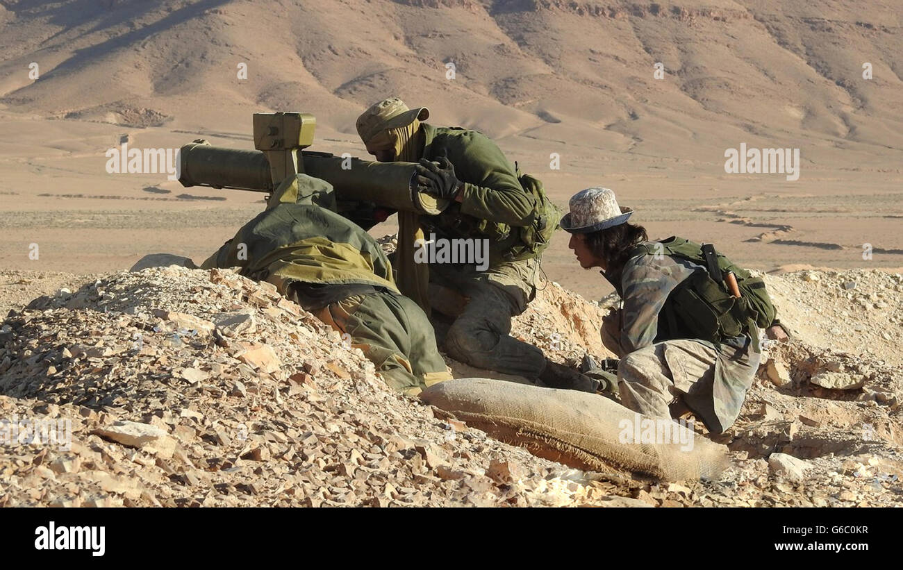 Islamic State fighters prepare to fire a captured TOW anti-tank missile during combat against Syrian government forces June 20, 2016 near Homs, Syria. The still image is captured from a propaganda video released by the Islamic State of Iraq and the Levant. Stock Photo