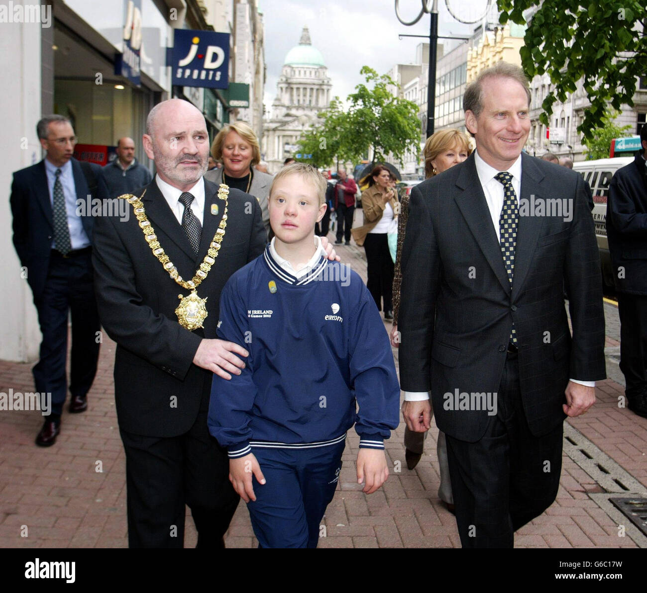 The United States Special Envoy to Northern Ireland, Ambassador Richard Haass (right), joins Belfast Mayor, Alex Maskey, and Special Olympic competitor, Sean Maguire, from Noth Belfast, on a walkabout in Belfast city centre, ahead of the 2003 Special Olmpics World Summer Games. Belfast will be acting as host city to more than 1,300 athletes and support staff from Team USA, who will be visiting Ireland for the 11th Special Olympics in exactly one month s time. Stock Photo