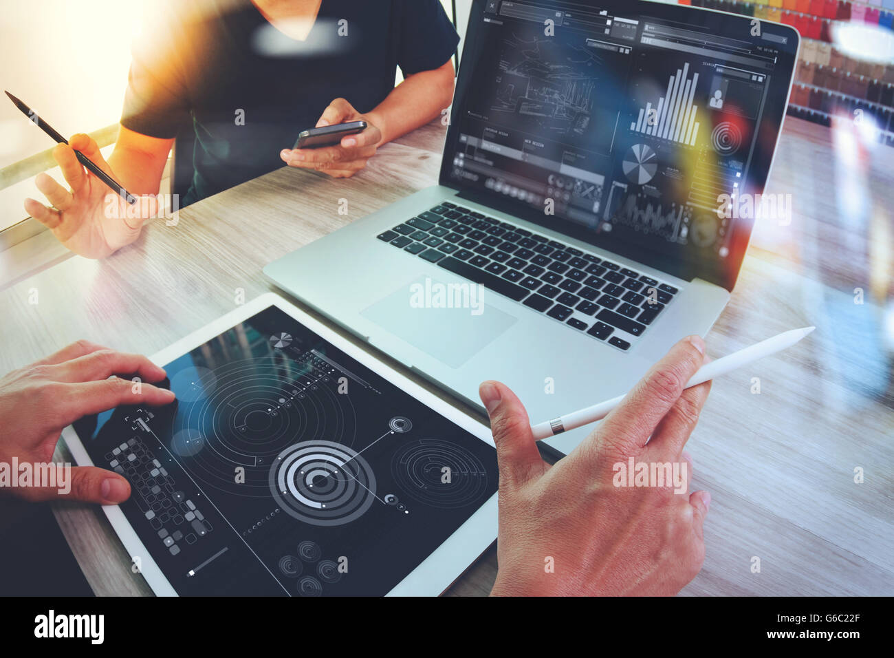 Businessman making presentation with his colleagues and business tablet ...