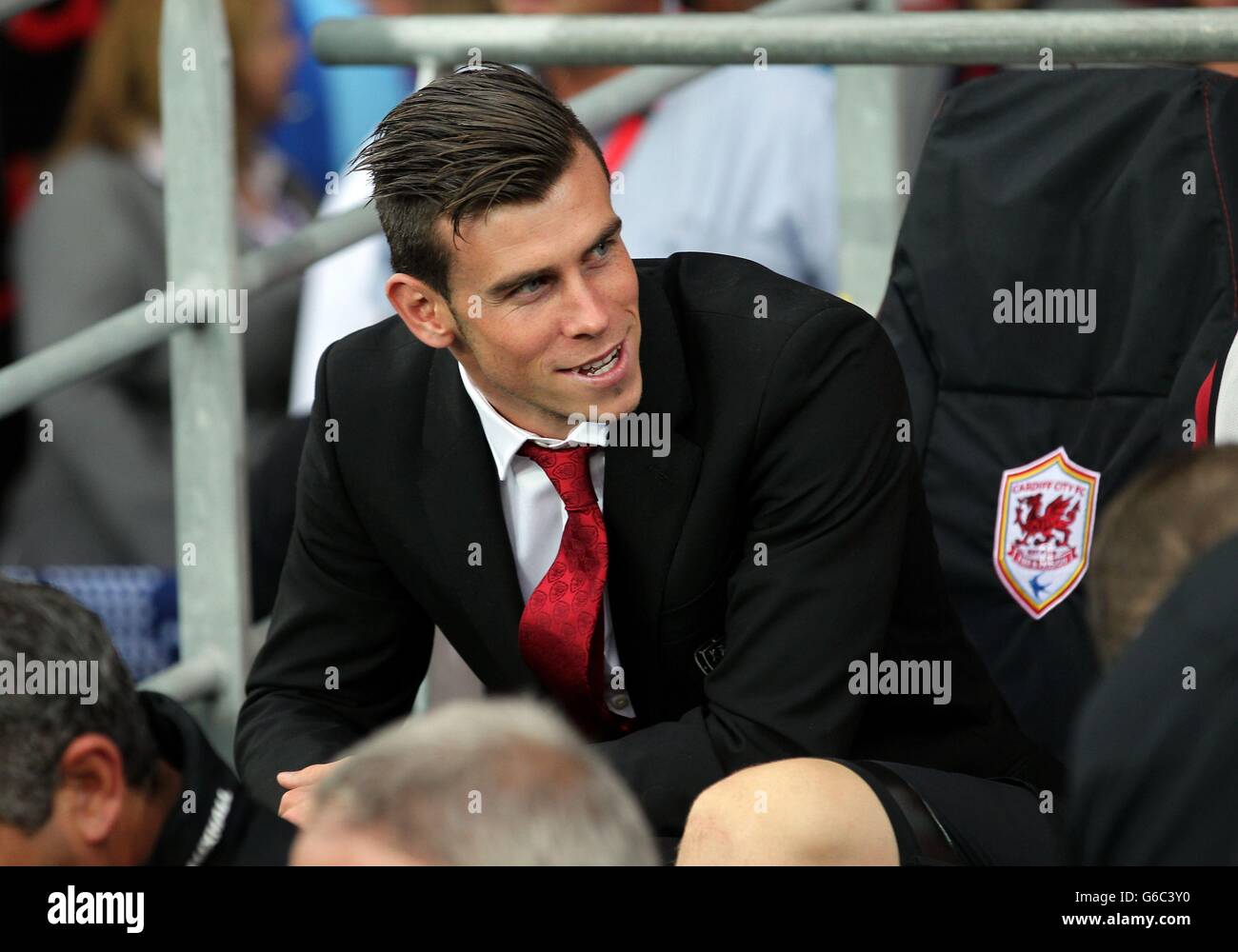 Gareth Bale takes his place on the bench during the International Friendly at Cardiff City Stadium, Cardiff. Stock Photo