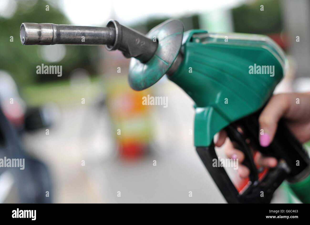 A view of a person using an Asda petrol pump in Chelmsford, Essex Stock