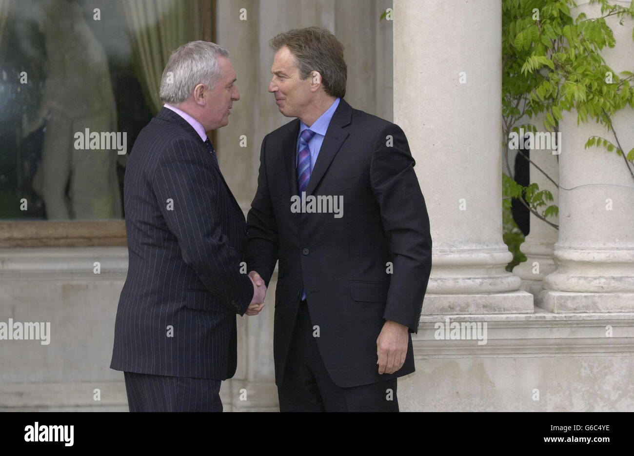 British Prime Minister Tony Blair, who is fifty today years-old warmly greets Irish Taoiseach Bertie Ahern, at Farmleigh House, Dublin, Republic of Ireland. * Mr Blair, had arrived in Dublin for crisis talks on the future of Northern Ireland peace process. Stock Photo