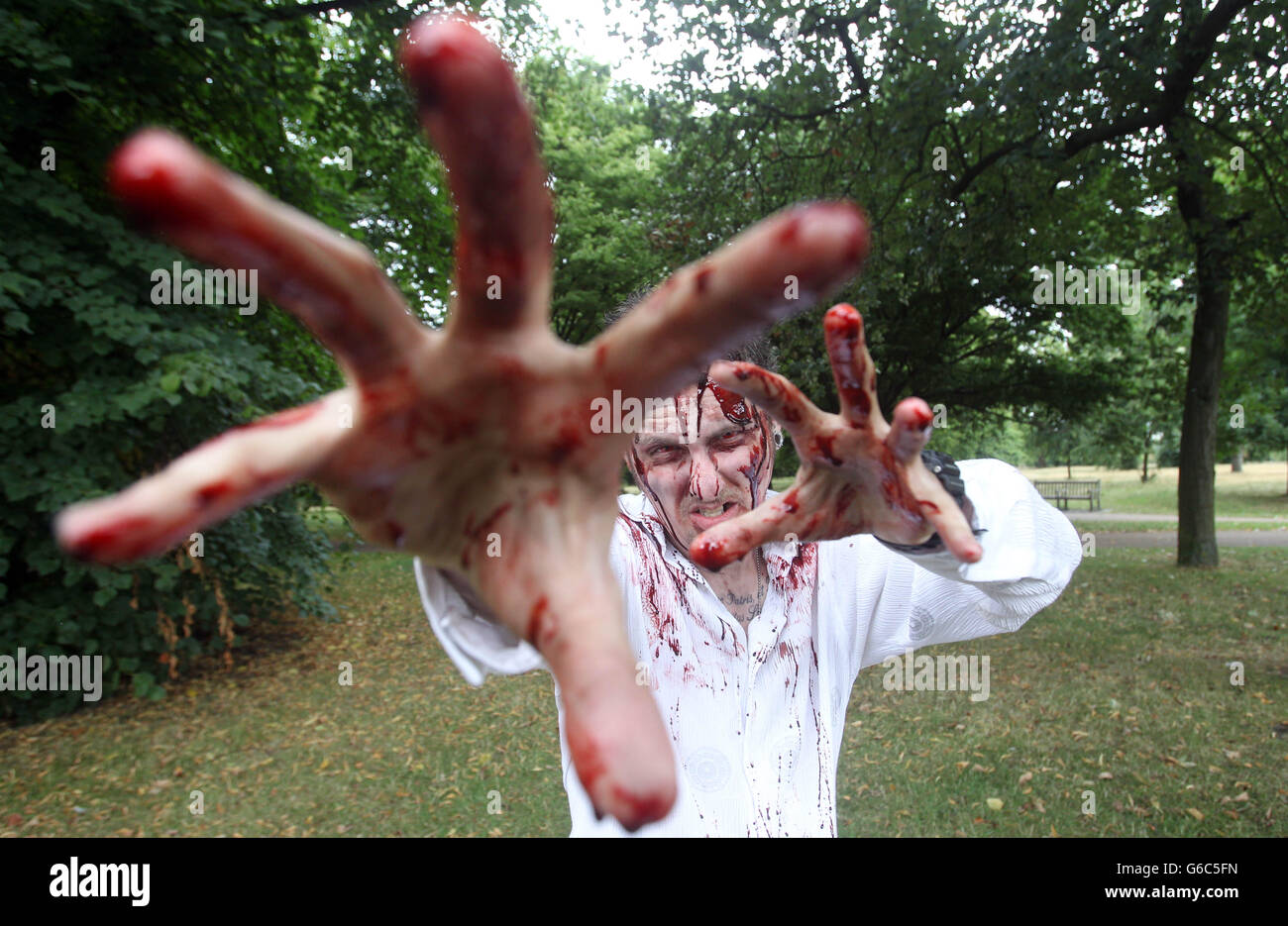 Zombies take part in a training day held in Hyde Park, London ahead of the Zombie Evacuation Race due to happen in October. Stock Photo