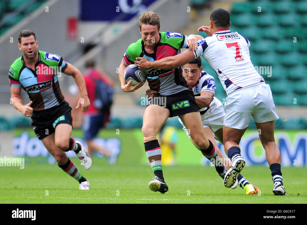 Harlequins' Miles Mantella is tackled in the semi final against Auckland  during the World Club Sevens at Twickenham Stadium, London Stock Photo -  Alamy