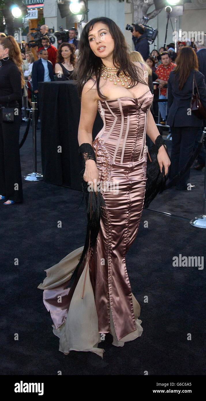 Actress Monica Bellucci, who stars in the film, arrives for the premiere of 'Matrix Reloaded' at The Mann Village theatre in Los Angeles. The Matrix Reloaded is written by the Wachowski Brothers and produced by Joel Silver. Stock Photo