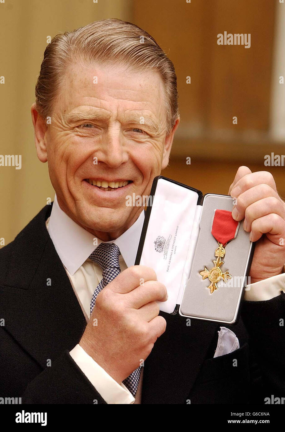 Actor Edward Fox proudly holds his OBE which was presented to him by the Queen at Buckingham Palace. Stock Photo