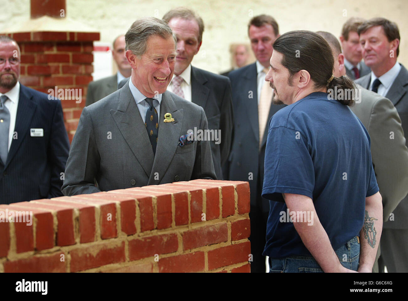 The Prince of Wales talkes to 'Malcolm' in the Brick Workshop, during a visit to Dartmoor Prison. The Prince of Wales had a taste of life behind bars when he visited the prison. * His first stop was a new workshop where he met prisoners taking part in a brick-laying course. The course is part of the prison's new programme, run in partnership with the local business community, which aims to prevent prisoners re-offending by teaching them work skills. The programme, launched in February, currently involves 16 prisoners in courses delivered by North Devon College. Stock Photo