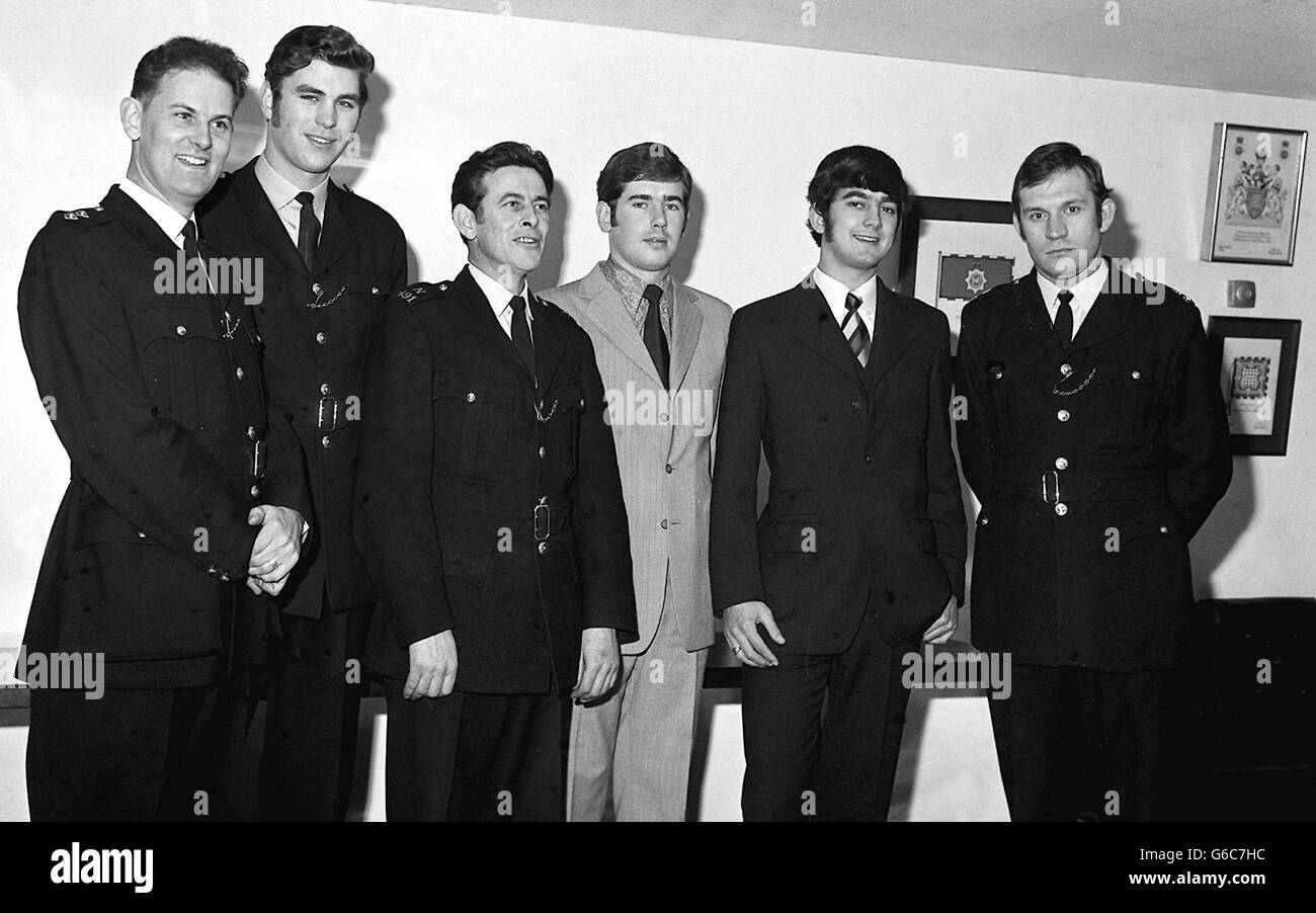 Uniformed and mufti-wearing police, seen at Scotland Yard. They are Metropolitan police officers awarded the British Empire Medal. (Left to right) : Inspector Peter Marsh, 32 Poole; Police constables Rodney Phillips, 26 of Ilford; John Price, 36 of Carmarthen; Peter Bowcock, 23 of Southampton; Robert Dench, 21 of Acton and Peter Butcher, 29 of Portsmouth. Stock Photo