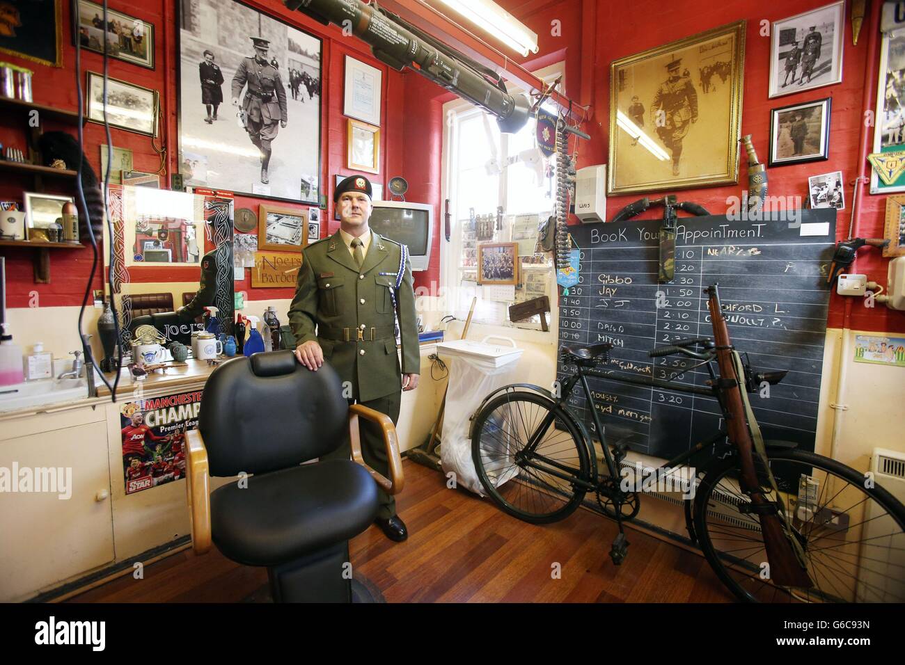 Barracks Barber Private Noel McDonnell, pictured in his shop after the