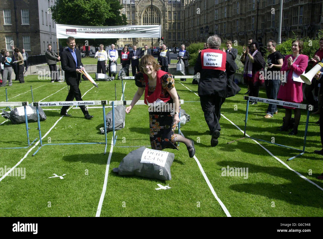 Val Davey, Labour MP for Bristol West represents Tanzania in a race against third world debt on College Green in central London. MP's from all three major parties were joined by six time gold medallist Steve Cram to call on world leaders to drop the third world debt. Stock Photo