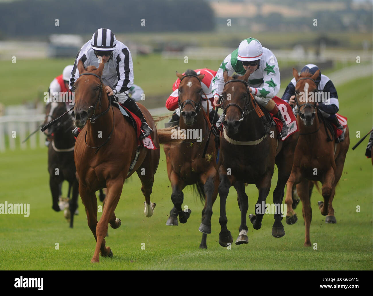 Jockey Wayne Lordan (left) rides Come to Heel to victory in The Irish Field Curragh Stakes Race during the Galileo Futurity Stakes Day at the Curragh Racecourse, Co Kildare, Ireland. Stock Photo