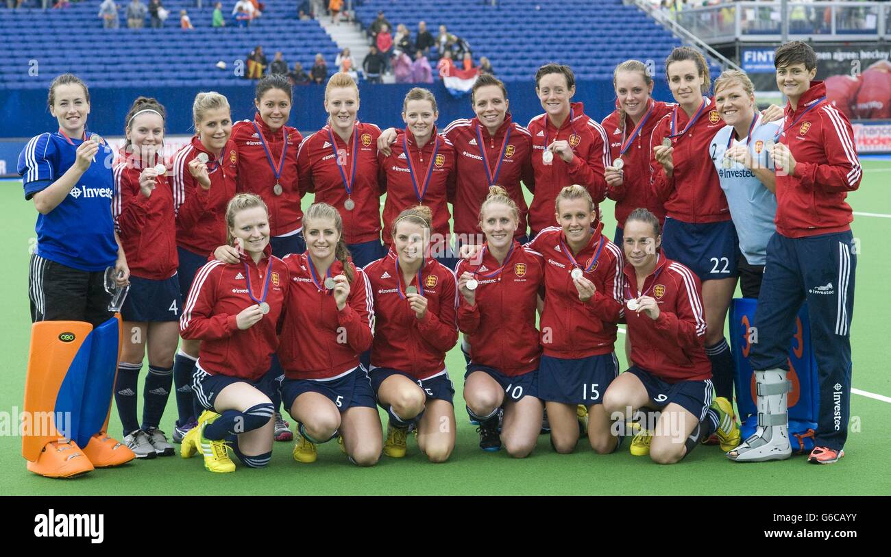 England pose with their silver medals after defeat to Germany during the Final of the TriFinance EuroHockey Championship at Braxgata HC, Boom, Belgium. Stock Photo