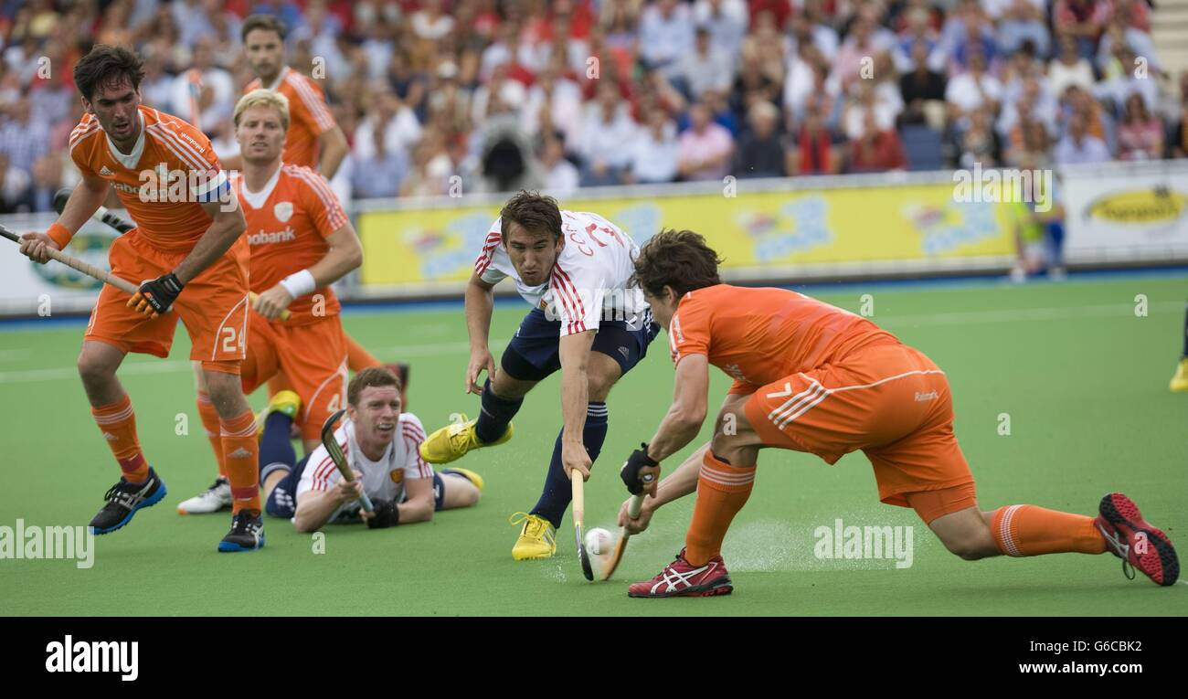 England's David Condon challenges with Netherland's Wolter Jolie during the bronze medal match of the TriFinance EuroHockey Championship at Braxgata HC, Boom, Belgium. Stock Photo