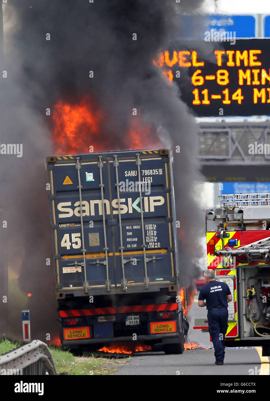 Fire fighters from Dublin Fire Brigade at the scene of a lorry fire on the M50 motorway close to the N4/5 exit near Dublin, Ireland. Stock Photo