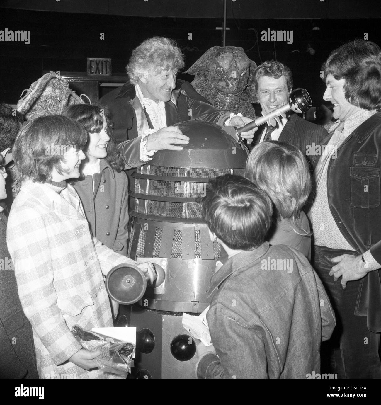 Doctor Who star Jon Pertwee attends the Fact or Fiction science show at the London Planetarium with a Dalek from the sci-fi series. Looking on are Blue Peter presenter Peter Purves (right) and the planetarium's director John Ebdon. Children from Dr Baranardo Homes were guests at the event. Stock Photo