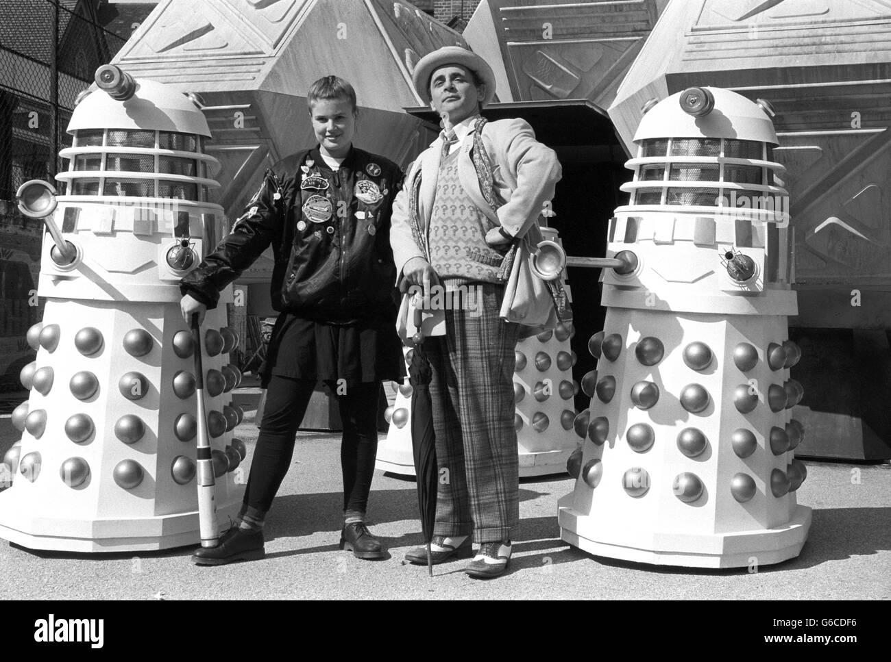 Sylvester McCoy as Doctor Who with his new assistant Ace, played by Sophie Aldred pictured with Daleks. Stock Photo