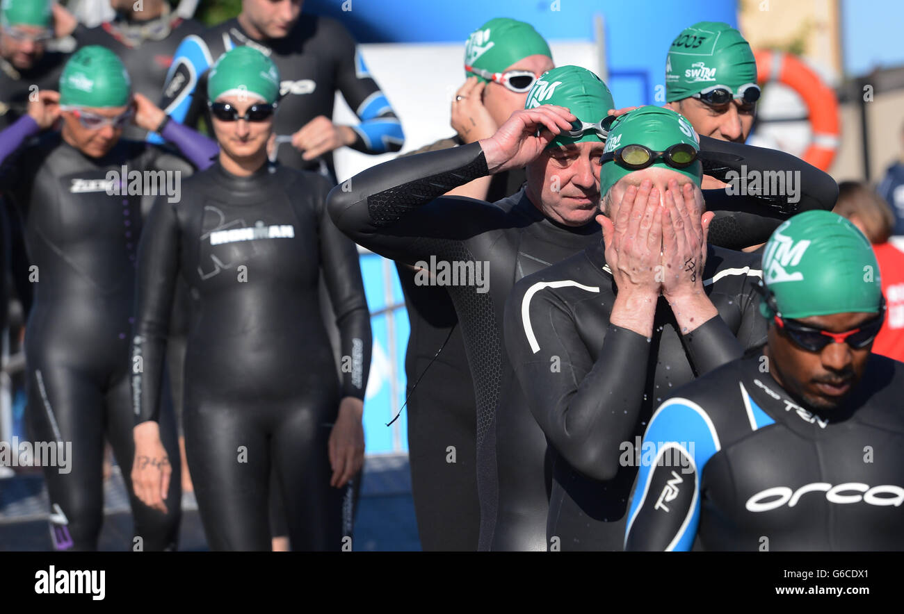 Participants take part in the Great London Swim in London's Dockland today. Stock Photo