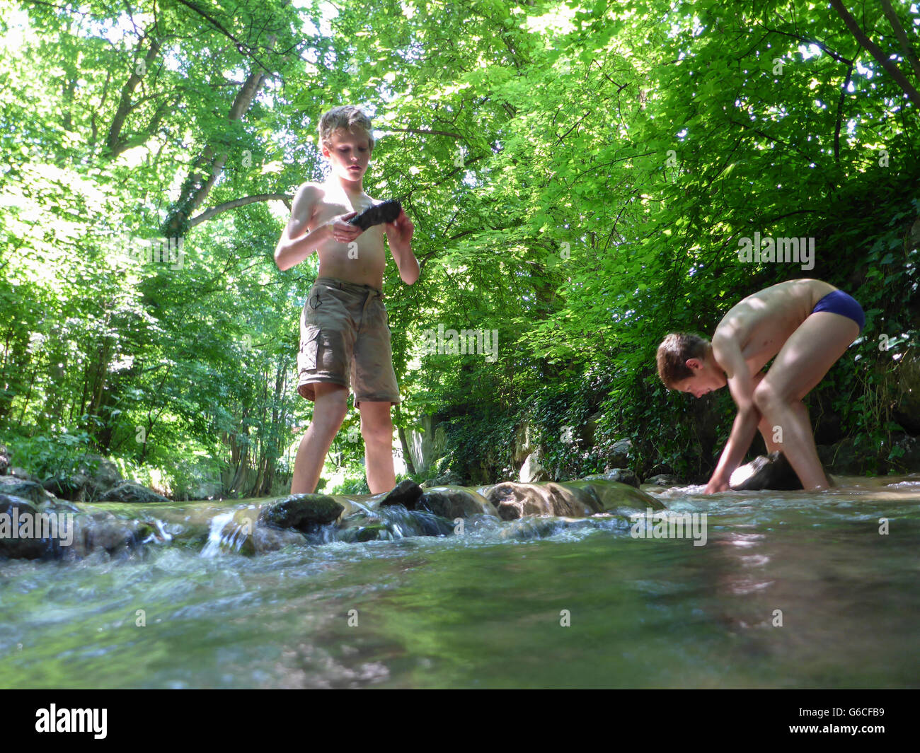 children playing in the creek Mödling, Mödling, Austria, Niederösterreich, Lower Austria, Wienerwald, Vienna Woods Stock Photo