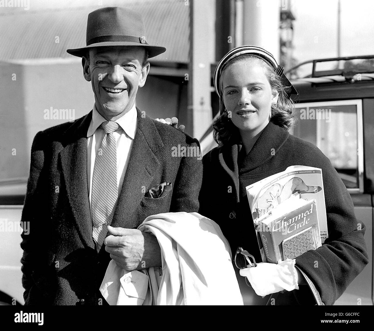 The man with the magic feet, Hollywood dancing star Fred Astaire, is pictured with his 14-year-old daughter Ava on their arrival at London Airport from New York. Stock Photo