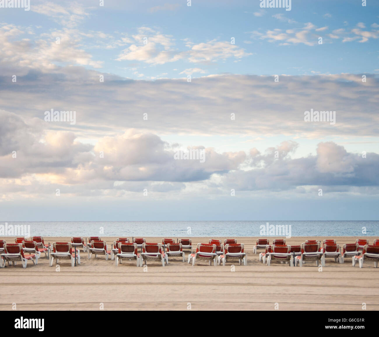 Empty sunloungers on beach in Spain. Stock Photo