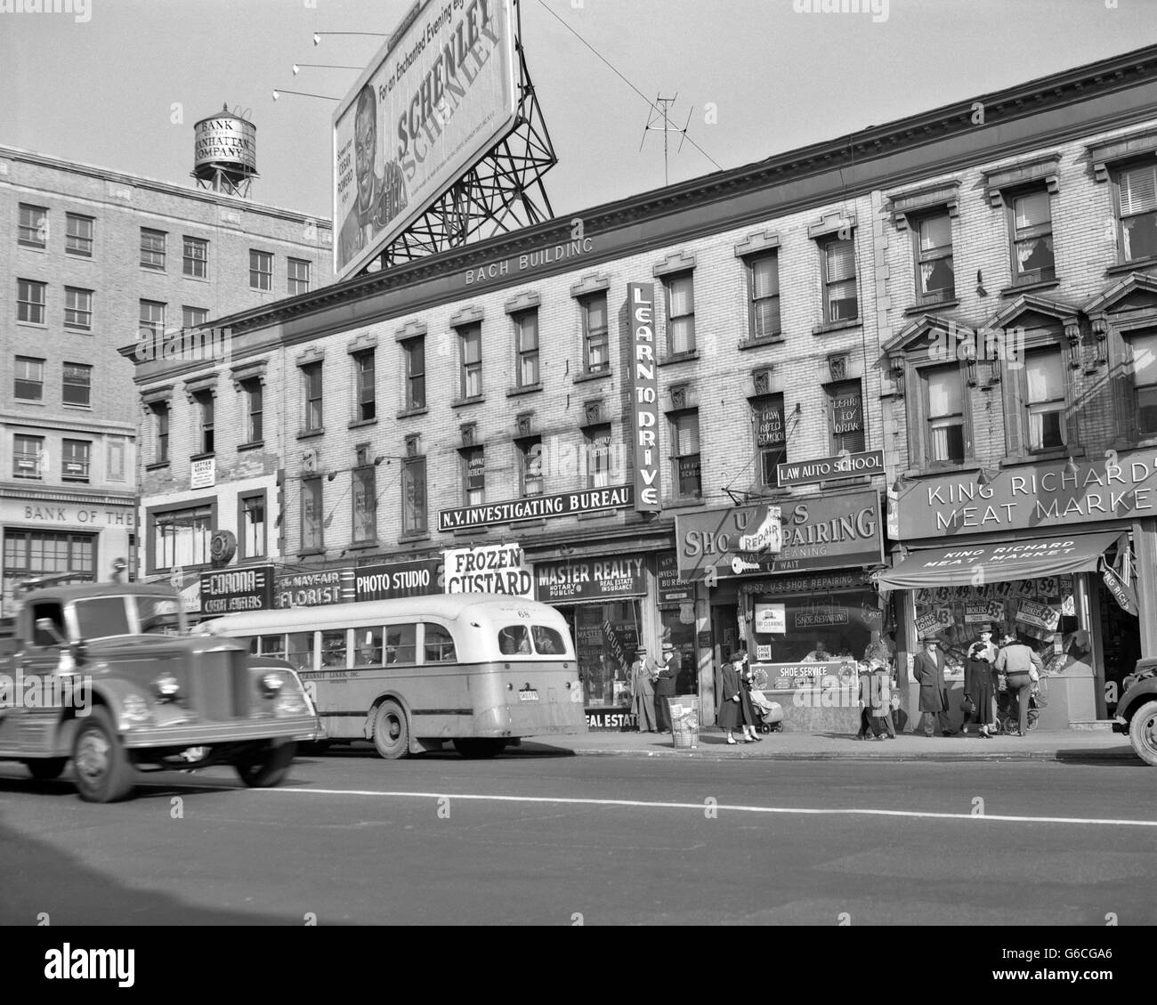 1950s MAIN STREET FLUSHING LONG ISLAND QUEENS STORE FRONTS BUS SHOPPERS NEW YORK CITY NY USA Stock Photo