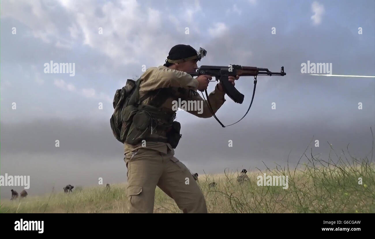 Islamic State fighters with the Storming Battalion attempt for the second time to capture Peshmerga Kurdish positions North of Mosul May 3, 2016 near Tesqopa, Iraq. The still image is captured from a propaganda video released by the Islamic State of Iraq and the Levant. Stock Photo