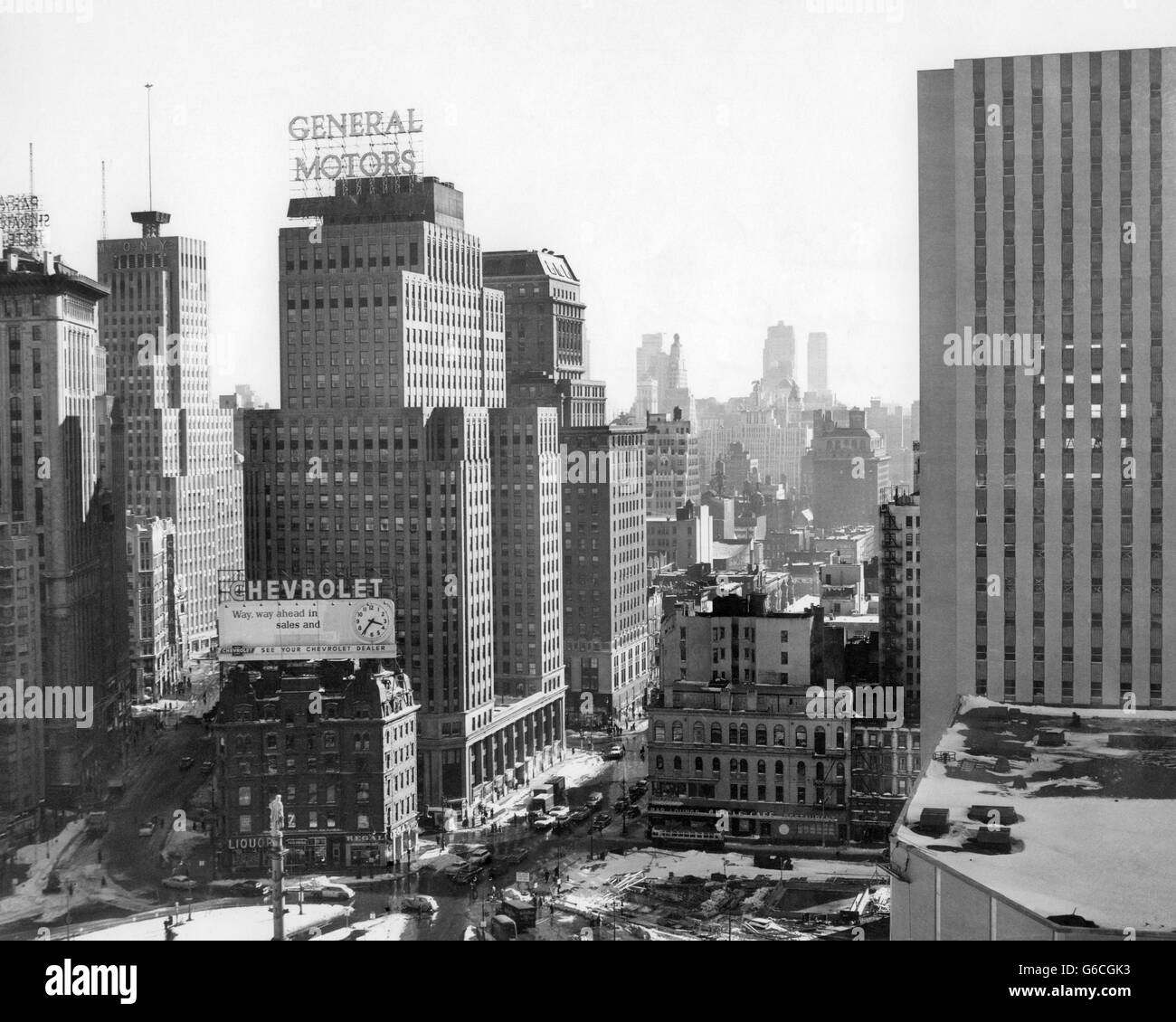 1950s LOOKING SOUTH AT 61ST STREET COLISEUM TOWER COLUMBUS CIRCLE EXCAVATION FOR NEW BUILDING BOTTOM CENTER NEW YORK CITY NY USA Stock Photo