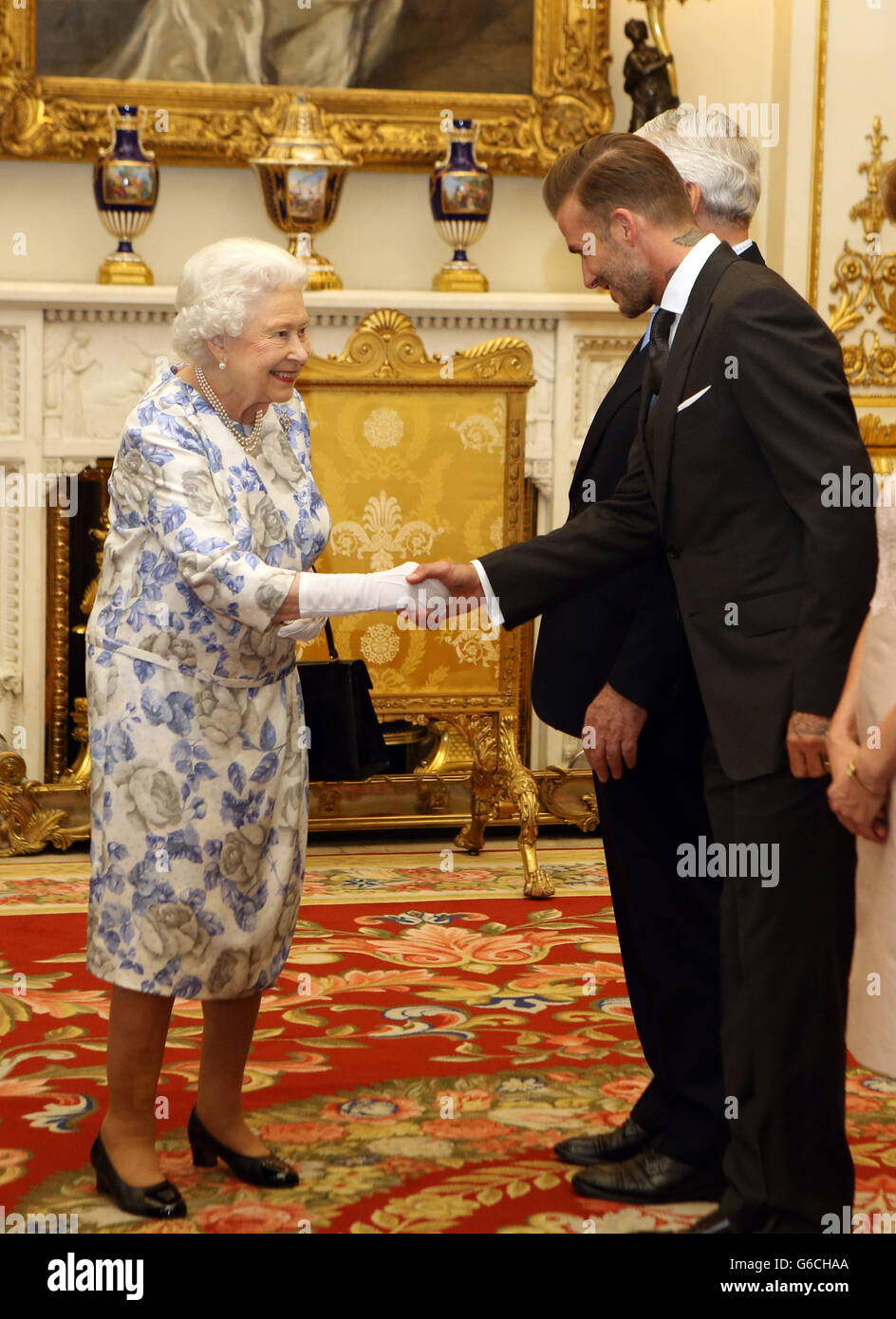 Queen Elizabeth II greets David Beckham as he attends the Queen's Young(02)