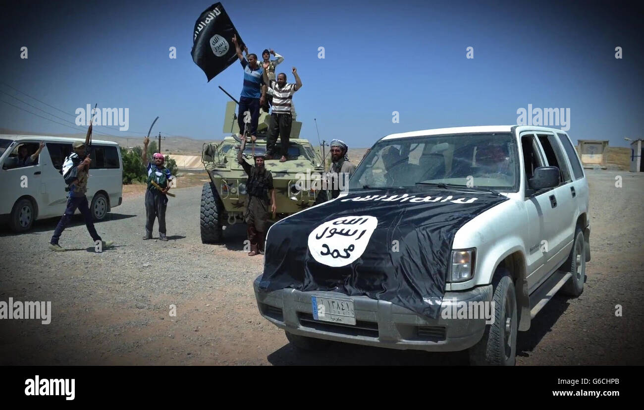 Islamic State fighters celebrate after over running an Iraqi outpost April 4, 2016 in the vicinity of Zawbaa, Iraq. The still image is captured from a propaganda video released by the Islamic State of Iraq and the Levant. Stock Photo