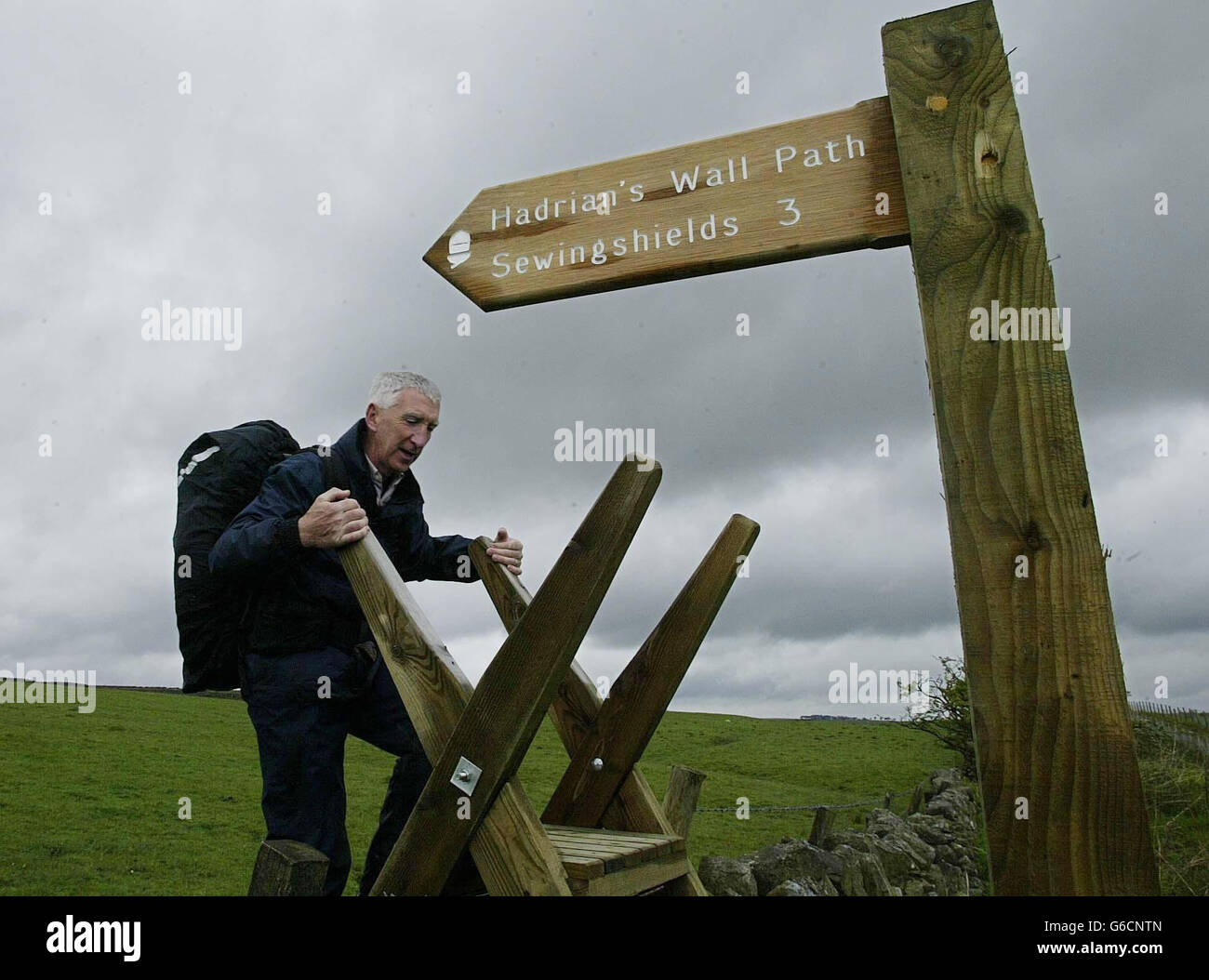 A walker on Hadrian's Wall where, for the first time in 1600 years, hikers will be able to follow the entire length of the wall - 84 miles - along an unbroken path. * The Hadrian's Wall Path is part of a 6million investment by the Countryside Agency, and is expected to attract 20,000 people a year by 2006. Hadrian's Wall - a World Heritage Site - was built by the Romans from 122 AD as one of the most northerly frontiers of their empire. Stock Photo
