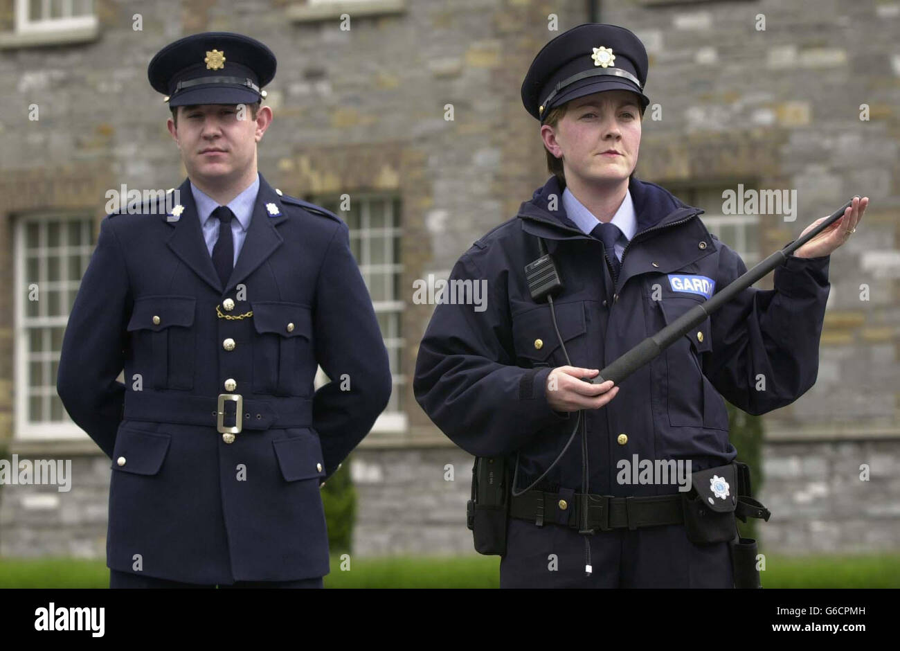 Student Garda, John Ormonde and Garda Hilda Small, model the old and new  Garda uniforms respectively, at a press conference at Garda Headquarters,  Dublin. The new uniform features a ultility belt, waterproof