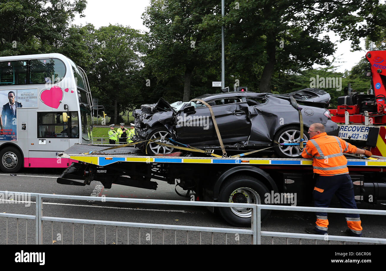 A car involved in a collision with a bus on Grange Road, outside the New Victoria Hospital in Glasgow, is removed from the scene. Stock Photo