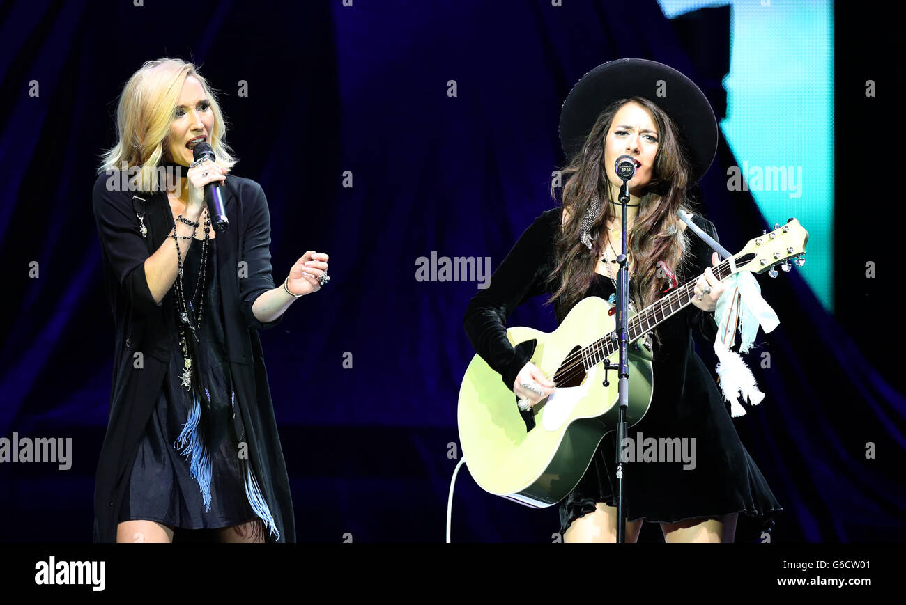 Ruby Stewart (left) and Alyssa Bonagura of The Sisterhood warm up the crowd ahead of Rod Stewart's performance at the Nottingham Motorpoint Arena. Stock Photo